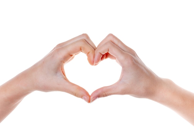 Woman hand making a heart shape. isolated on white