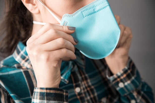 Woman hand medical mask