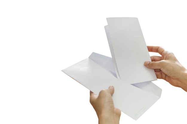 Woman hand putting letter on an envelope isolated in white background