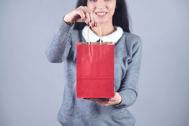 Woman hand red shopping bag