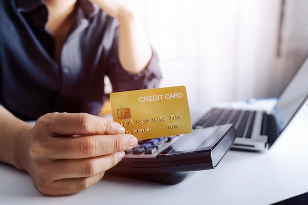 Woman hand using mobile smart phone online payment banking and online shopping at the home