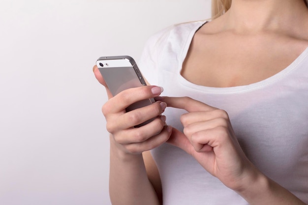 Woman hand using a smartphone. Closeup shot