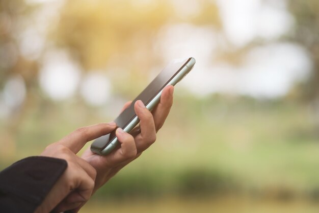 Woman hand using smartphone to do work business, social network, communication concept.