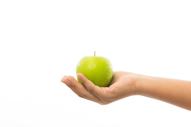 Woman hand with green apple isolated on white background