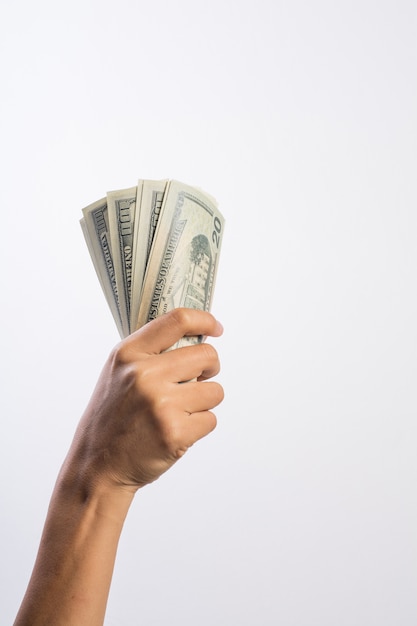 Woman hand with money isolated on white background