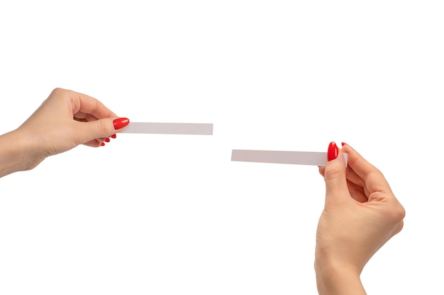 Woman hand with red nails with test strips for the perfume isolated on a white background