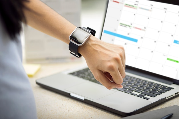 Woman hand with smart watch on wristcept.