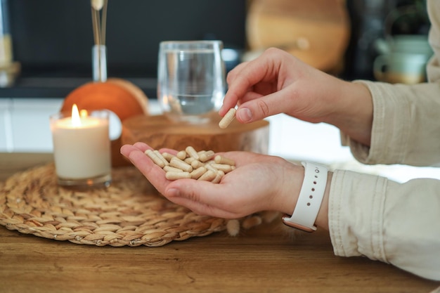 Woman hand with vitamins and pills for medicine for depression anxiety or mental health stress