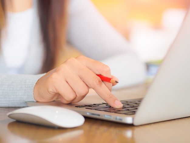 Woman hand working on her laptop. Social, technology concept.