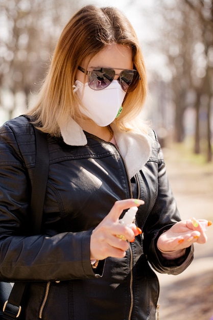 Woman handles hands with an antiseptic