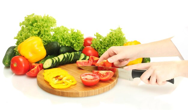 Woman hands cutting vegetables on kitchen blackboard