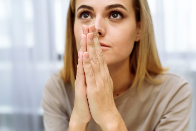 Woman hands praying to god. Woman Pray for god blessing to wishing have a better life. begging for forgiveness and believe in goodness. Christian life crisis prayer to god.