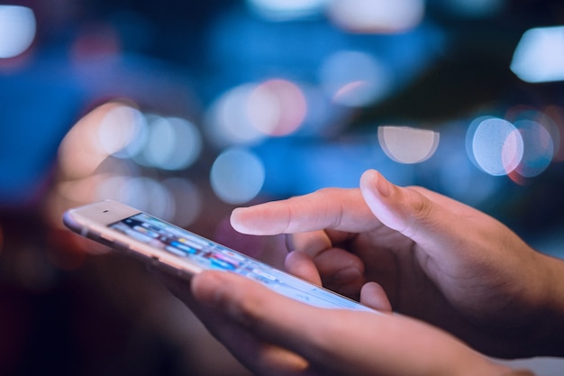 woman hands using mobile smart phone 