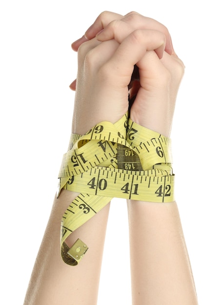 Woman hands with measuring tape isolated on white