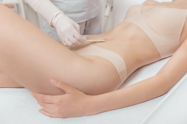 Woman has a laser epilation and cosmetology procedure