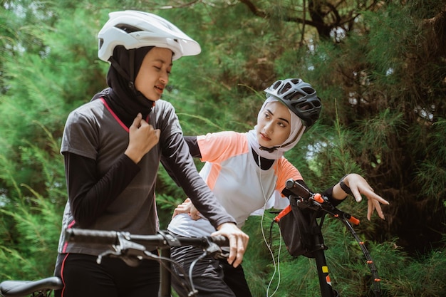 A woman has a sore throat while cycling with friends