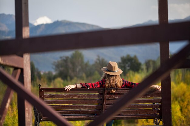 Woman in hat on the bench