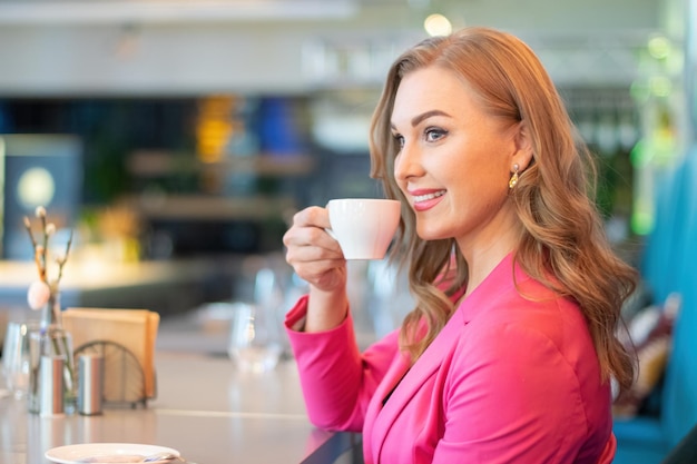 Woman having a coffee in a cafe