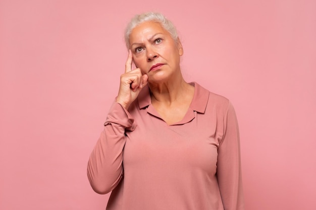 Woman having doubts and being confused thinking about an idea or worrying about her family