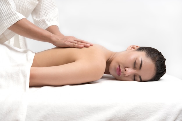 Woman having spa body massage treatment