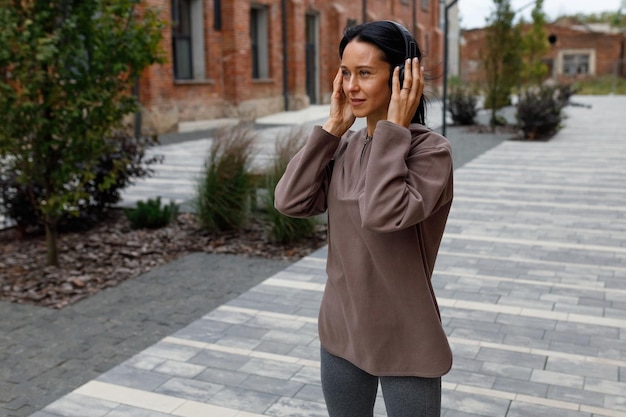 Woman in headphones listens to music