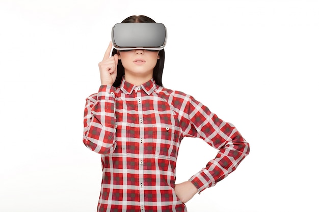 Woman in headset spending time in virtual reality.