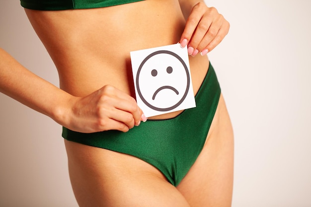 Woman Health Female Body Holding Sad Smile Card Near Stomach