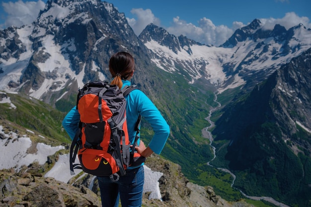 Woman hiker on a top of a mountain