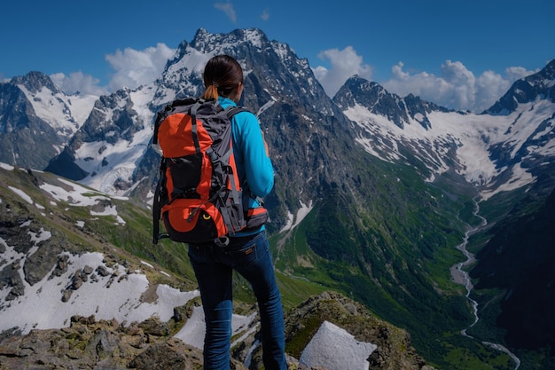 Woman hiker on a top of a mountain