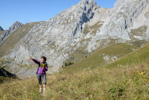 A woman hiker on a trail in the French Alps