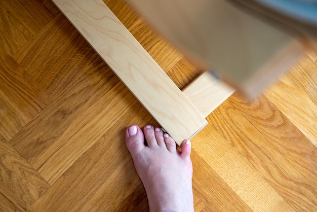 Woman hit furniture with the little toe incident at home injury of foot little finger