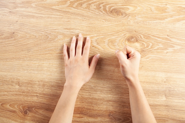 The woman hit the table with her fist