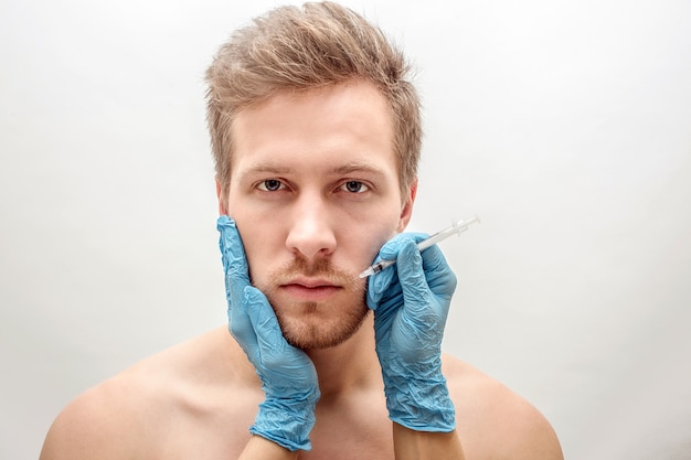 Woman hold her hands on man's face