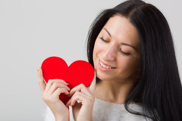 Woman hold red heart portrait venentine's day concept