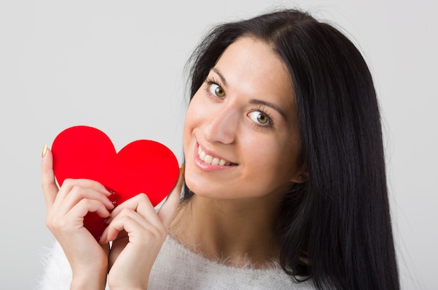 Woman hold red heart portrait