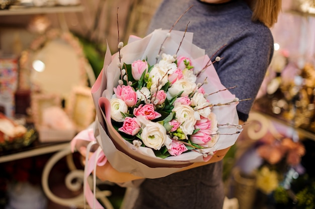 Woman holding a beautiful bouquet of flowers