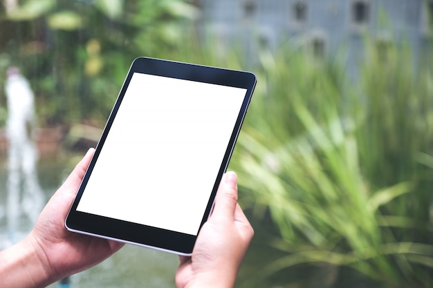 Woman holding black tablet