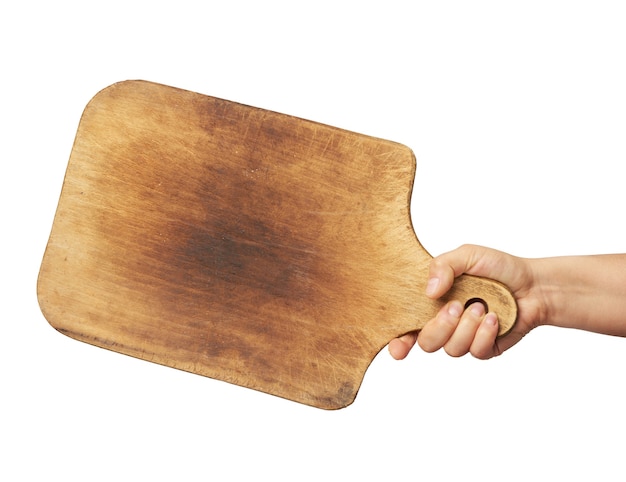 Woman holding blank brown rectangular wooden board in hand