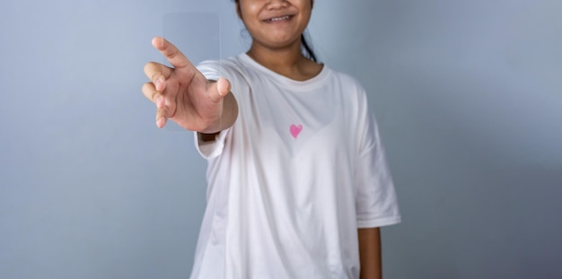 Woman holding a blank screen phone mockup transparent acrylic used for displaying text or advertis.