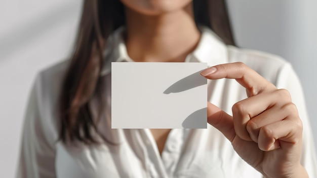 Woman holding a business card