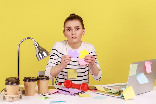 Woman holding colorful pieces of puzzle two parts of one symbol of connection and union