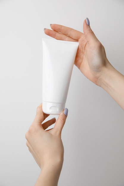 Woman holding a cream tube