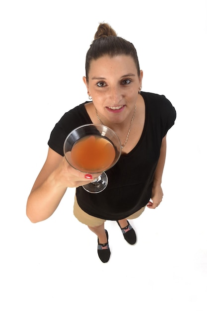 woman holding a cup of cocktail on white background