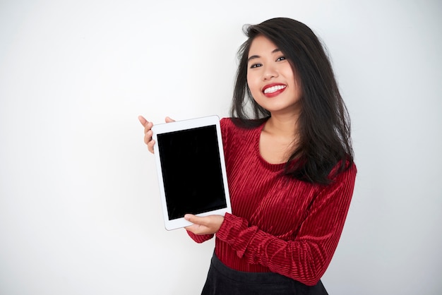 Woman holding digital tablet