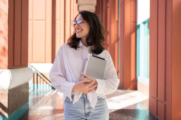 Woman holding digital tablet