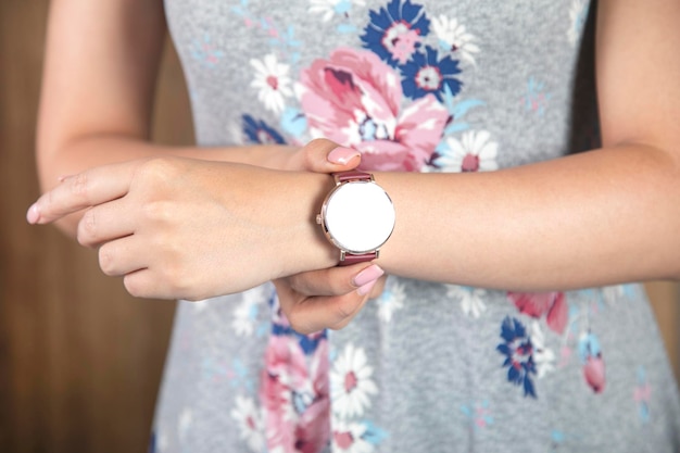 The woman holding fashion watch