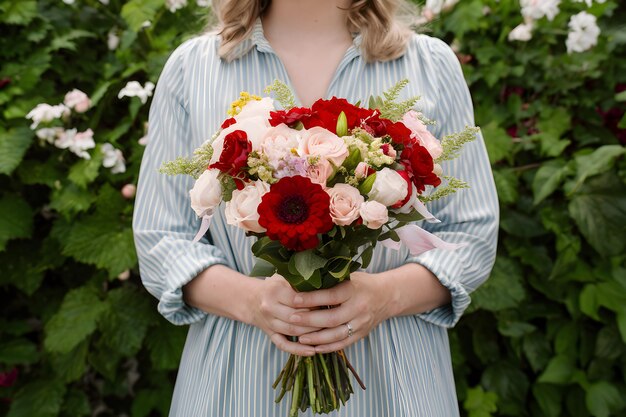 Woman holding a flower bouquet captures Mothers Day essence