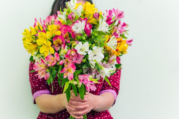 Woman holding flowers bouquet