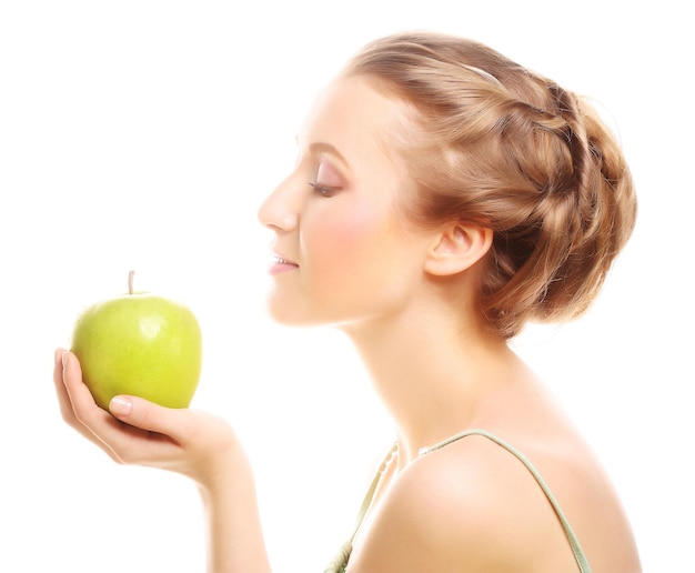 Woman holding green apple