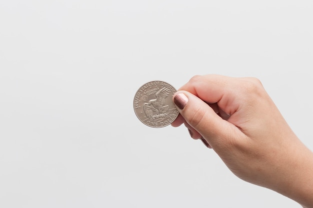 Woman holding hand of 1 dollar commemorative coin man's arrival to the moon